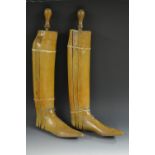 A pair of early 20th century beech gentleman's riding boot trees,