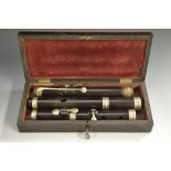 A rosewood flute, by Wallis, London, stamped, nickel-plated keys and mounts, 60cm long,