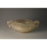 A Chinese mutton fat hardstone low censer, fluted ovoid reservoir, scrolling cloud and ring handles,