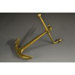 A Victorian gilt brass novelty desk weight, cast as a ship's anchor, axe head handle, 19cm long, c.