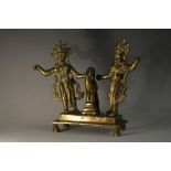 A 19th century Indian bronze shrine group, cast as two deities beside a bird, rectangular base,