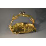 A French gilt metal shell shaped trinket dish, floral scroll handle, 12cm diam, c.