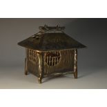 A Japanese bronze incense burner, as a thatched hut, 10cm wide, 9cm high,