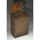 A George III oak rectangular candle box, shaped and pierced cresting, hinged sloping cover,