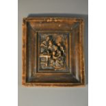 A 19th century wax picture, moulded after an Old Master with a domestic scene, 9.5cm x 8.