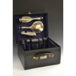 A George V gentleman's black leather travelling case, comprising hair brush,