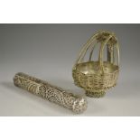 An early 20th century silver filigree cylindrical openwork needle case,