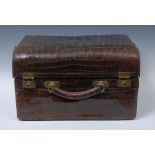 A late 19th/early 20th century crocodile suitcase,