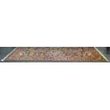 A Persian Balchitiari carpet, geometric floral reserves in iron red ,