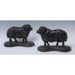 A pair of cast iron novelty door stops, cast as sheep, serpentine bases, 22.