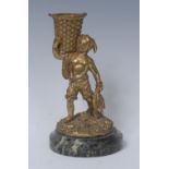 A 19th century gilt bronze match holder, cast as a bare footed fisher boy,