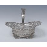 A 19th century Dutch silver boat shaped swing handled cake basket, pierced border,