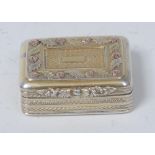 A George IV gold coloured metal mounted silver-gilt rounded rectangular vinaigrette,