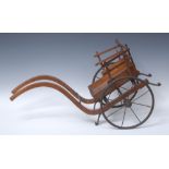 A 19th century miniature two-wheel cart, arched shafts, spoked iron wheels,