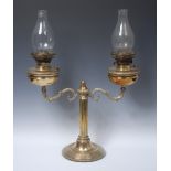 An early 20th century brass double oil lamp, Duplex type burners,