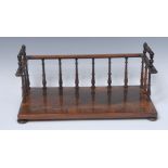 A Regency rosewood bookrack, spindled three-quarter gallery, ring turned angular handles, 38cm wide,