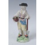 A Derby Patch Mark figure, Gardener, he stands wearing a broad brimmed hat and fancy waistcoat,