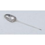 A mid-18th century silver mote spoon, pierced bowl with anthemion to verso, pointed terminal, 12.