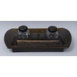 A Regency rosewood and brass marquetry boat shaped inkstand,