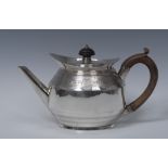 A George III silver teapot, knop finial, deep navette shaped rim,