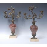 A pair of 19th century bronze and veined marble three-light candelabra,