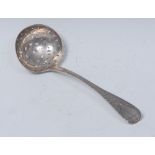 A George IV Irish silver Bright-cut Old English pattern sifter spoon, 19cm long, James Le Bas,