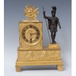 A French Empire ormolu and bronze clock, the gilt dial embossed with floral roundel,