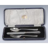 An Art Deco silver three piece christening set, comprising knife, fork and spoon, Sheffield 1927,