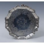 A George III shaped circular silver card waiter, engraved with crest to centre,