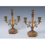 A pair of 19th century Sienna marble and ormolu two-light candelabra, flaming grenade finials,