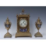 A 19th century brass clock garniture, the 9.