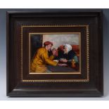 A Limoge rectangular plaque, enamelled by F J Carmona, with elderly Romany couple taking a rest,