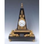 A French Empire ormolu and belge noir clock, the white dial with Roman numerals,