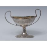 A 19th century Continental silver navette shaped twin-compartment pedestal salt,