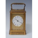 A French gilt brass quarter-repeating carriage clock, 5.