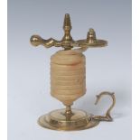 A George III brass wax jack, scissor action, flying looped handle, circular base, 13.5cm high, c.