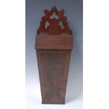 A 19th century mahogany tapered rectangular wall hanging knife box, shaped and pierced cresting,