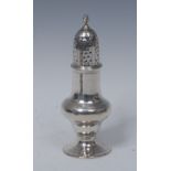 A George III silver pear shaped pepper, spiral finial, domed pierced cover, spreading circular foot,