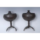A pair of 19th century coconut pedestal bowls on stands, carved overall with stylised foliage,