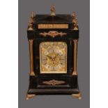 A late 19th century ebonised and gilt metal mounted bracket clock,