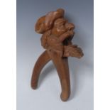 A pair of large Black Forest lever nut crackers, boldly carved as a bearded pirate,