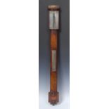 An early 19th century Russian mahogany stick barometer, silvered dial, mercury thermometer,