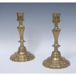 A pair of 18th century French brass candlesticks, of seamed construction,