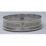 A George V silver circular wine coaster, of George III design,