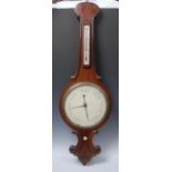 A large Victorian mahogany wheel barometer, 28cm register, alcohol thermometer,