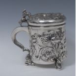 A Danish silver cylindrical peg tankard, hinged bun shaped cover set with a coin,