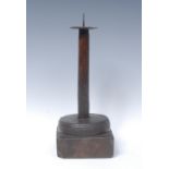 A 19th century primitive pricket candlestick, steel drip pan, fruitwood stem and socle,