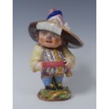 A Derby Mansion House Dwarf, he stands with a low broad brimmed hat, colourful waistcoat,