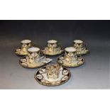 An Aynsley coffee set in silver holders comprising five cups, six saucers and six holders,