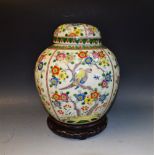 A large 19th century Chinese ginger jar on hardwood stand